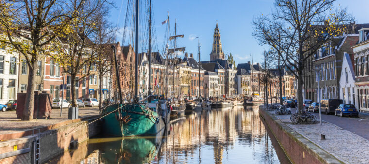 Panorama of historic ships and warehouses in the center of Groningen, The Netherlands